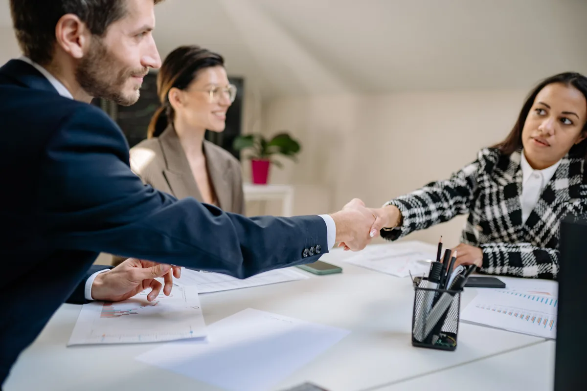 Recruiter and candidate shaking hands after a meeting